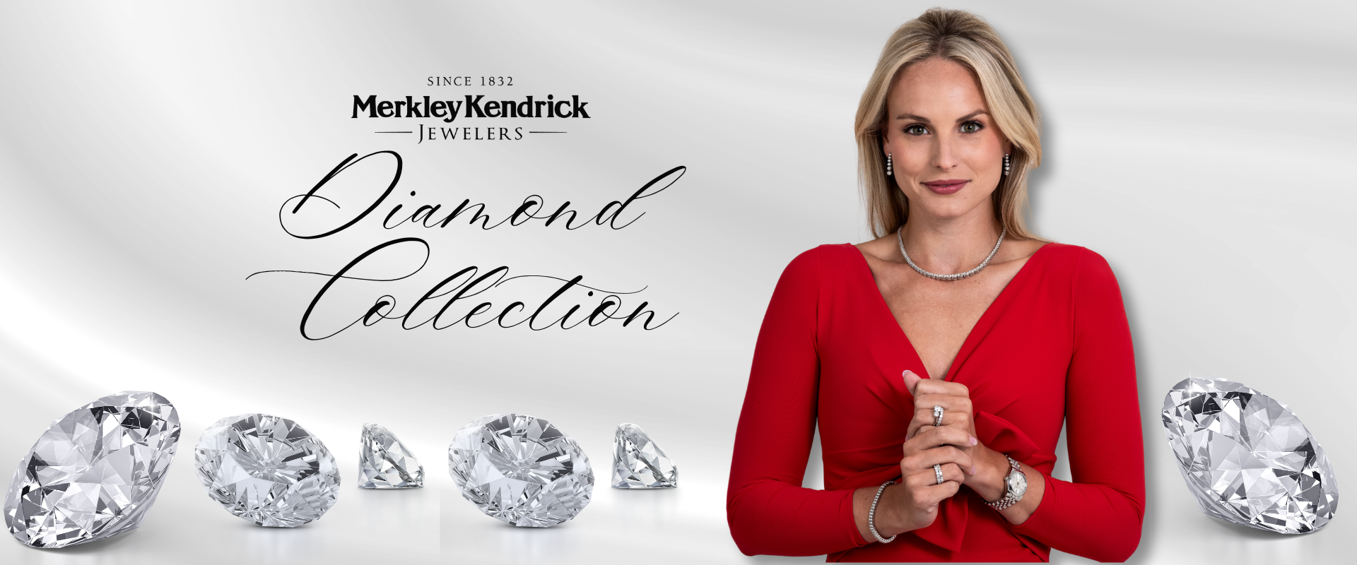 Elegant woman in red showcasing the Diamond Collection by Merkley Kendrick Jewelers with sparkling diamonds in the foreground.